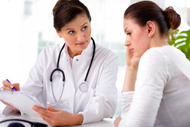 Doctor with female patient royalty free stock photography