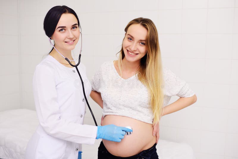 Doctor Obstetrician Gynecologist Examines A Young Pretty Pregnant Woman Stock Image Image Of 