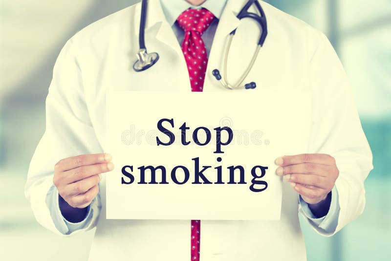 Doctor hands holding white card sign with stop smoking text message