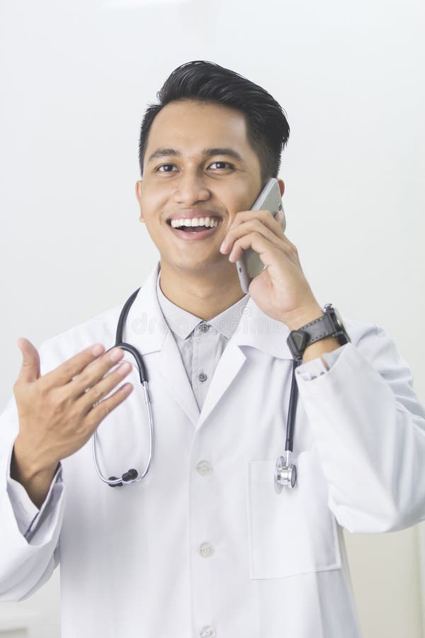 Doctor Having Phone Call at His Medical Office Stock Image Image of