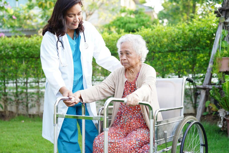 Doctor Help Asian Elderly Woman Disability Patient Walk with Walker in