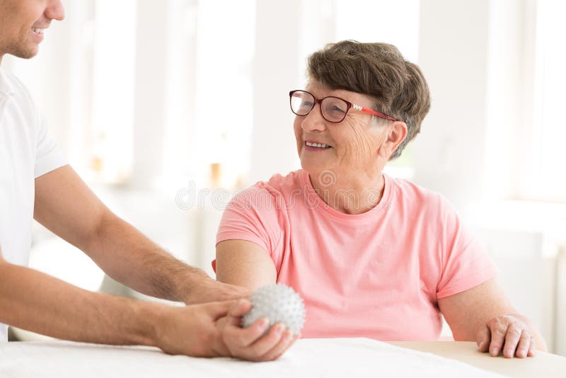 Older woman in hand physiotherapy stock photo Older woman in hand physiotherapy stock photo