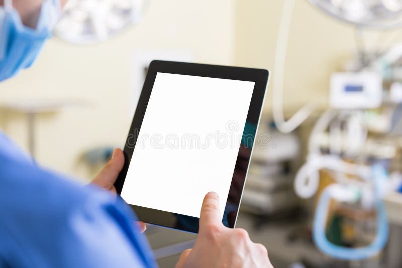 Doctor holding blank screen tablet
