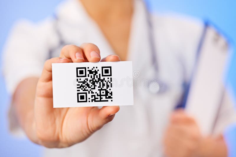 Doctor holding business card with QR code