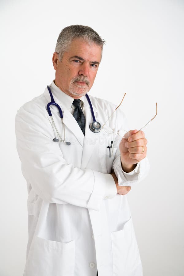 Doctor Holding Eyeglasses II Stock Image Image of friendly, smiling 2399903