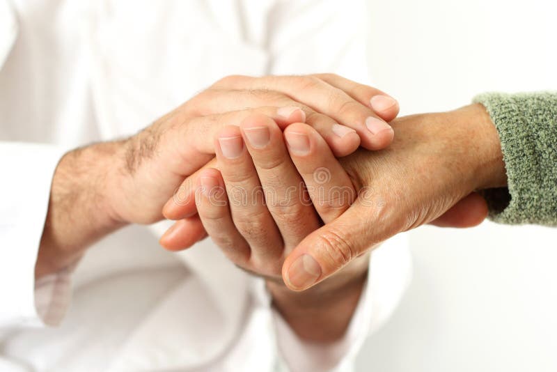 Doctor holding senior s hands