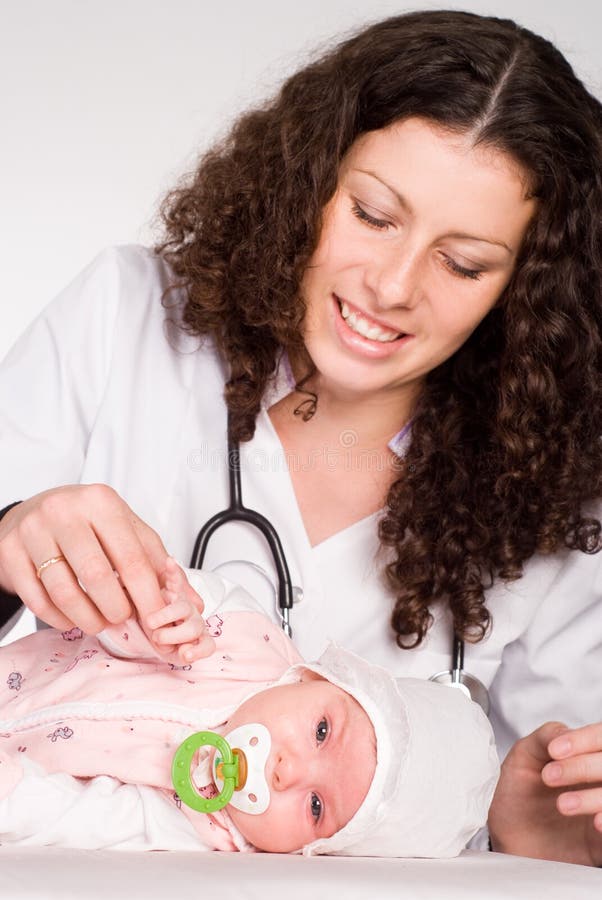 Doctor holds a baby