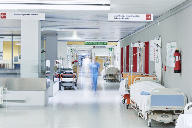 Doctor hospital corridor blurred lift red bed