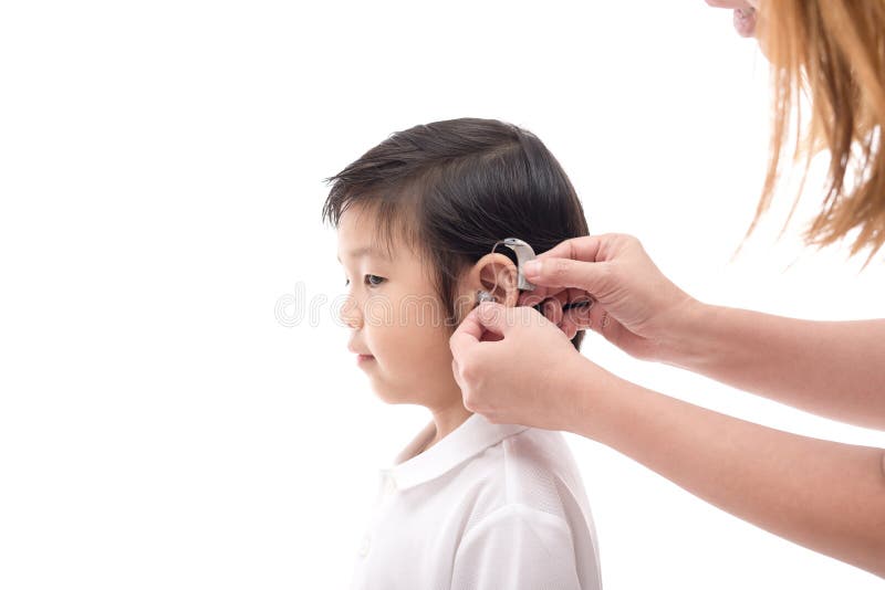 Doctor Inserting Hearing Aid