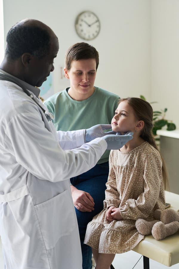 Examining Patient Young Girl in Medical Office Setting royalty free stock image