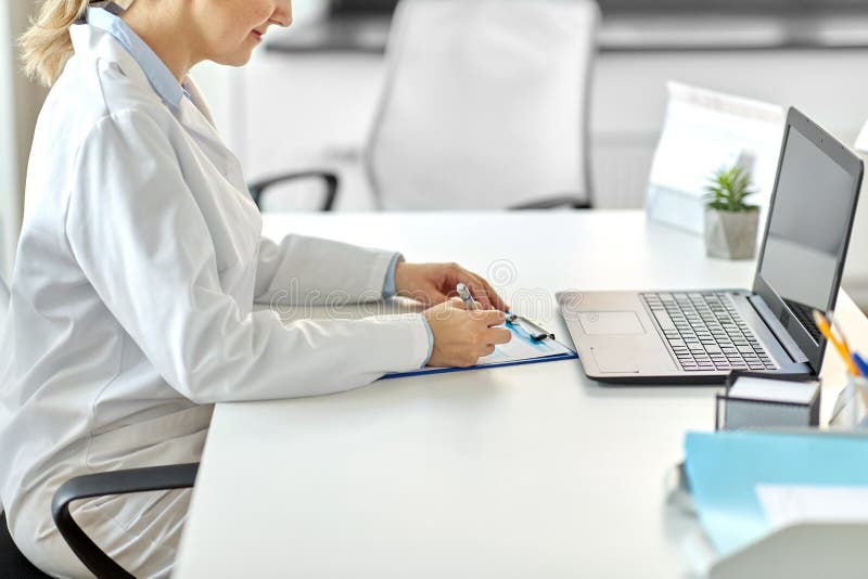 Download Doctor With Laptop And Medical Report At Hospital Stock ...