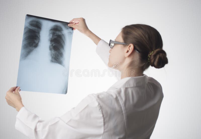 Doctor Looking Chest Xray. Young Doctor with Xray Stock Photo Image