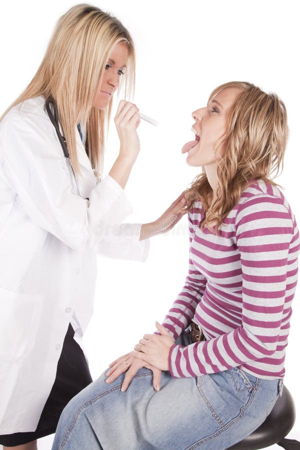 Doctor looking into females mouth