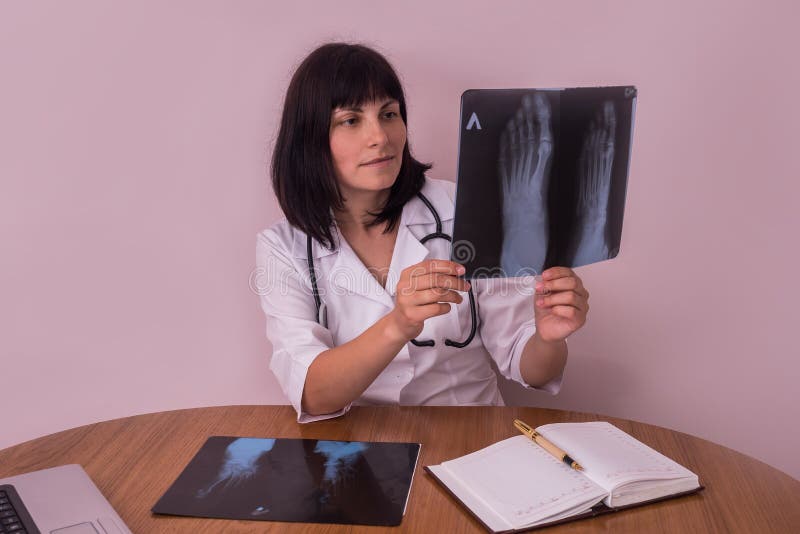 Doctor Looking at Patient`s Xray of a Foot Stock Image Image of