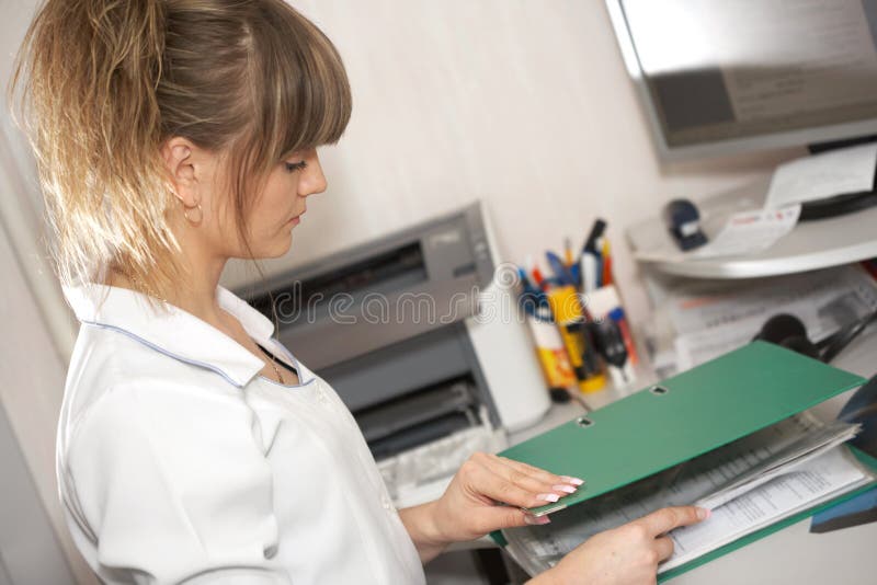 The doctor looks the documents stock images