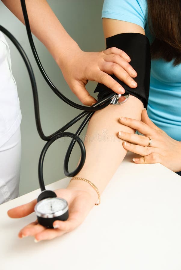 Doctor measuring blood pressure