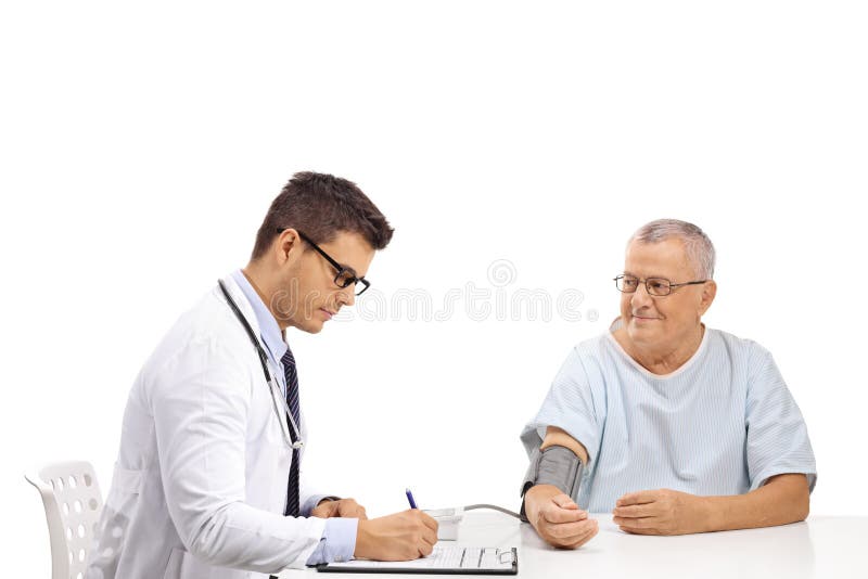 Doctor measuring blood pressure to a mature male patient royalty free stock photo Doctor measuring blood pressure to a mature male patient royalty free stock photo