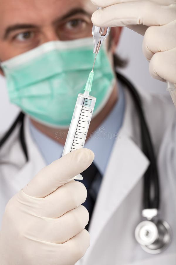 A Doctor with Medical Syringe Stock Image Image of background