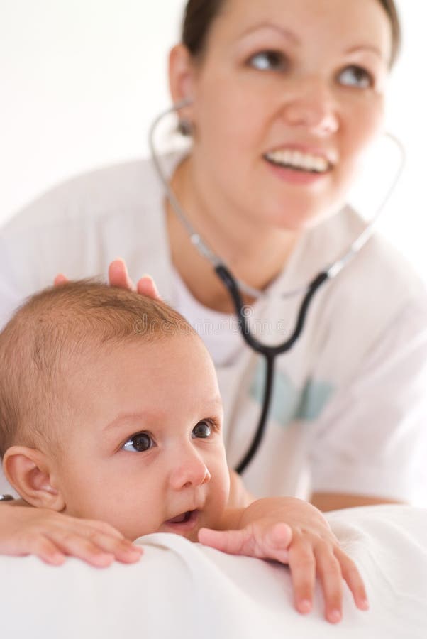 Baby and Doctor Pediatrician. Doctor Listens To the Heart with S Stock