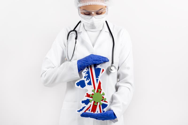 Doctor or nurse holding UK map and flag. Coronavirus outbreak and pandemic concept. 2019-nCoV.