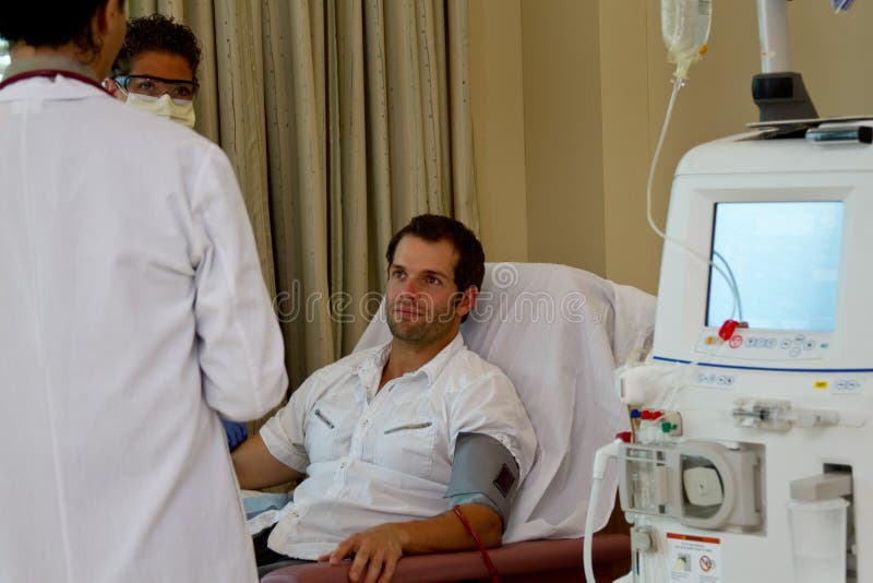 Doctor, nurse and patient reviewing care stock photography Doctor, nurse and patient reviewing care stock photography