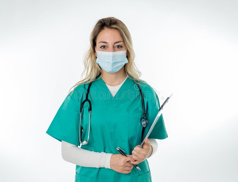 Doctor or nurse wearing scrubs and protective medical face mask. Medicine and health care workers