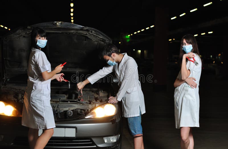 The Doctor and Nurses Repair the Car Stock Photo Image of female
