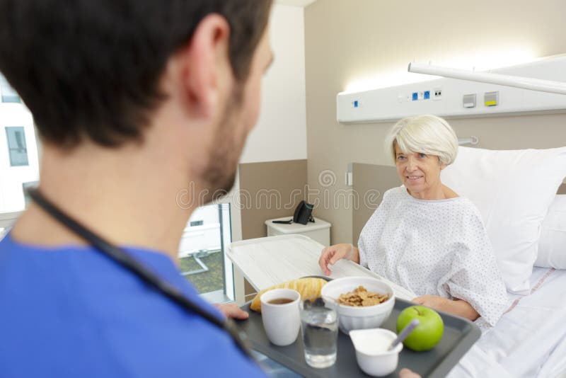 Doctor and patient on bed stock photo. Image of recovering 258799030