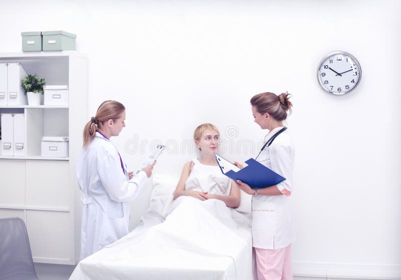 Doctor and patient discussing something while sitting at the table . Medicine and health care concept stock photos Doctor and patient discussing something while sitting at the table . Medicine and health care concept stock photos