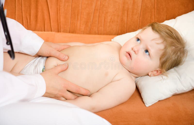 Doctor pediatrician exam baby abdomen royalty free stock photos