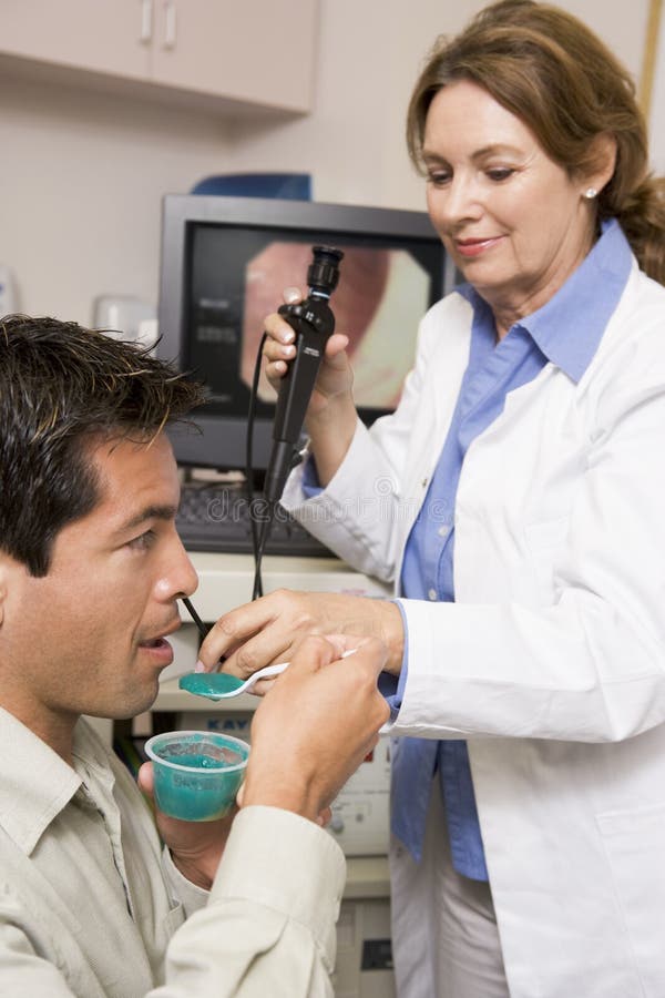 Doctor Performing Laryngoscopy on Patient Stock Image Image of