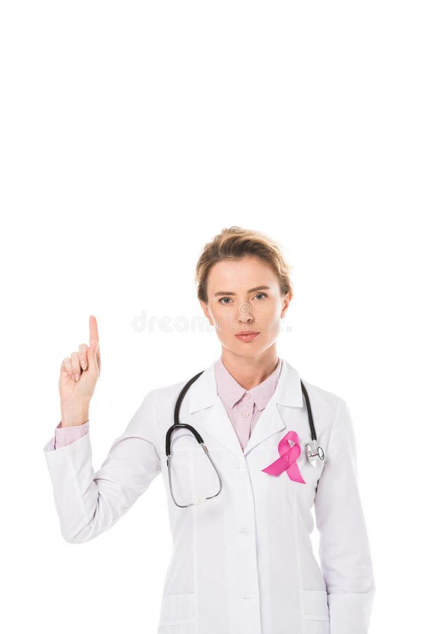 doctor with pink ribbon pointing up with finger and looking at camera stock photo doctor with pink ribbon pointing up with finger and looking at camera stock photo