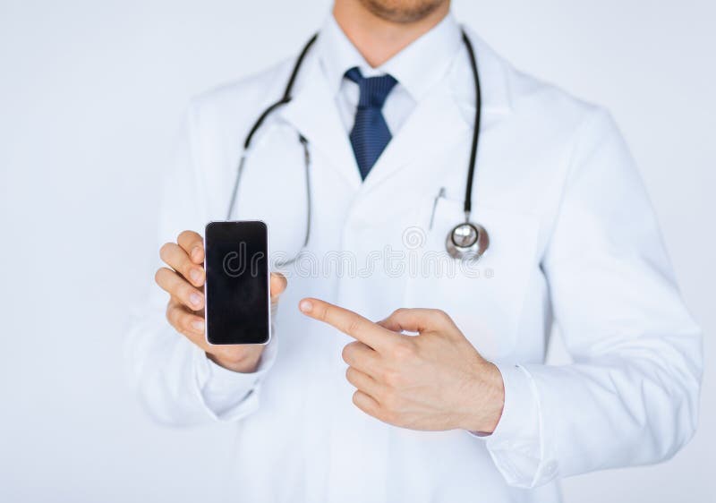 Close up of male doctor pointing at smartphone