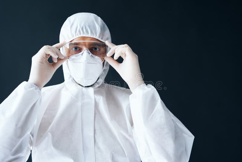 Doctor in PPE Wearing Protective Glasses on Black Background Stock ...