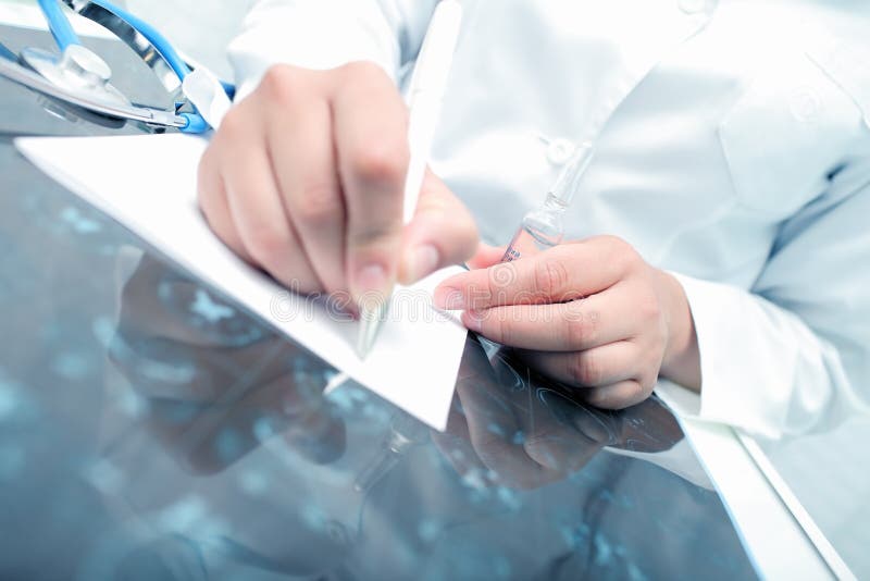 Doctor prescribes the drug to the patient royalty free stock photography