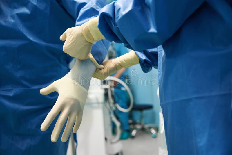 Doctor is Put on Sterile Gloves before the Surgical Operation Stock