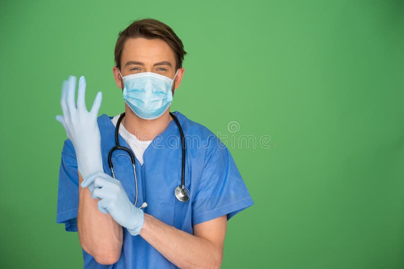 Doctor putting on surgical gloves stock image Doctor putting on surgical gloves stock image