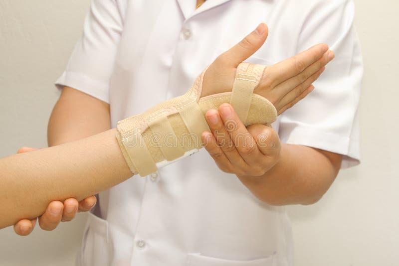Doctor putting wrist brace royalty free stock photos