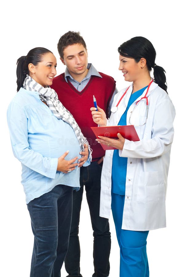Happy doctor having conversation and giving explanations to a pregnant woman and her husband isolated on white background. Happy doctor having conversation and giving explanations to a pregnant woman and her husband isolated on white background