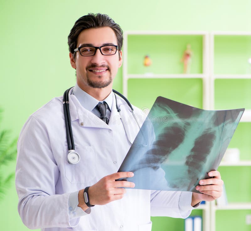 Doctor Radiologist Looking at Xray Scan in Hospital Stock Photo