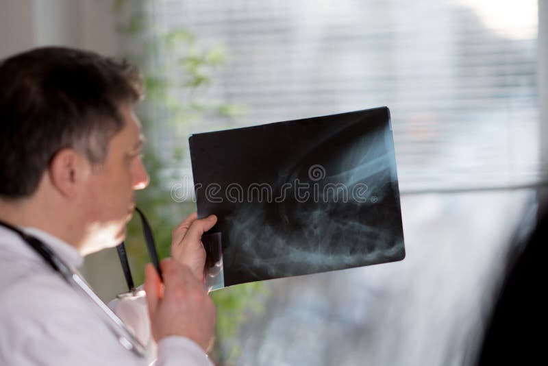 Doctor Reading Xray Images Stock Photo Image of pediatrician