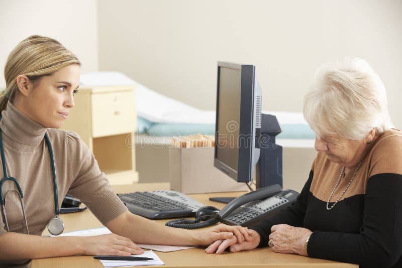Doctor reassuring senior woman patient royalty free stock photo Doctor reassuring senior woman patient royalty free stock photo