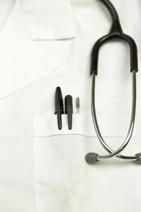 Doctor Scrubs with Stethoscope, Thermometer and Pens in the Pock Stock