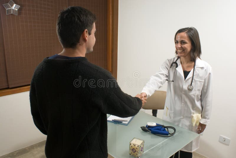 Doctor Shaking Hands with Patient - Horizontal