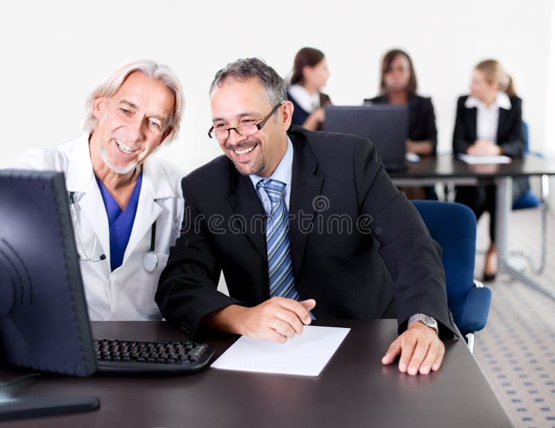 Doctor showing his patient a prescription