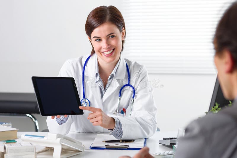 Doctor showing tablet to patient royalty free stock photos Doctor showing tablet to patient royalty free stock photos