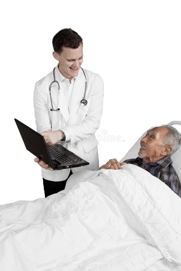 Doctor shows laptop to elderly male patient stock image Doctor shows laptop to elderly male patient stock image