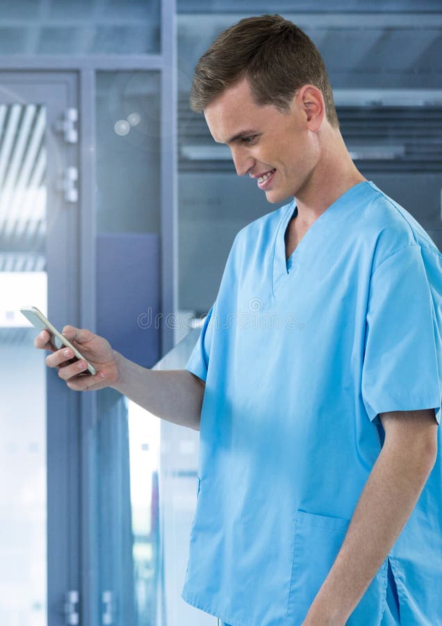 Doctor Smiling at Mobile Phone with Apps in Modern Room Stock Image