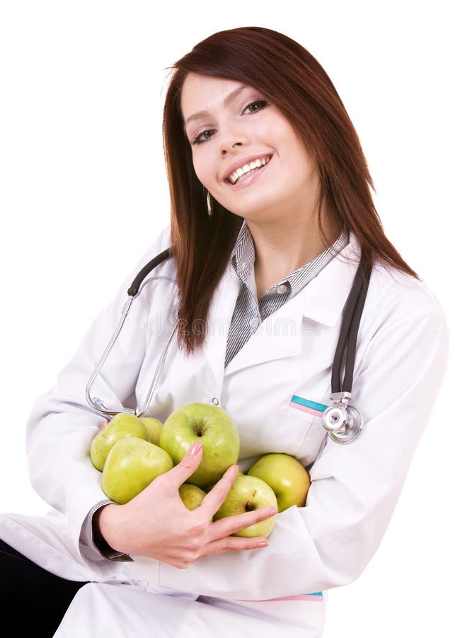 Doctor with stethoscope and group green apples.