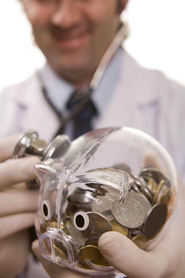 Doctor with stethoscope and piggy bank